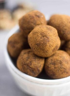 Classic fall flavors make their way into these Pumpkin Cinnamon Raisin Balls for the perfect snack or energy ball pick-me-up. Vegan, paleo, and Whole30 approved! - Eat the Gains