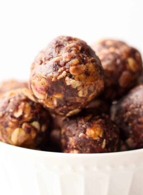 Vegan & gluten free 4 ingredient Peanut Butter & Jelly Energy Balls take your favorite childhood combo & turns it into a healthy & easy on-the-go snack! - Eat the Gains