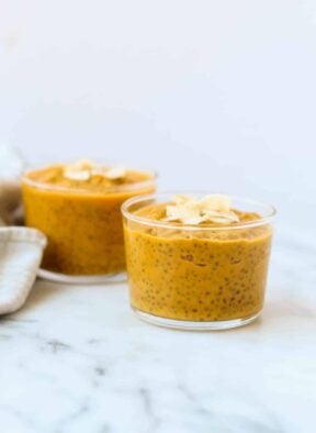 This Carrot Cake Chia Pudding takes the flavors of a classic dessert and turns it into a healthy snack that is paleo, vegan, and dairy & gluten free - Eat the Gains