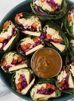 A fun and healthy red, white, & blue veggie packed dish, these Party Sized Chicken Collard Wraps with Peanut Sauce make the perfect appetizer for a BBQ or party! - Eat the Gains