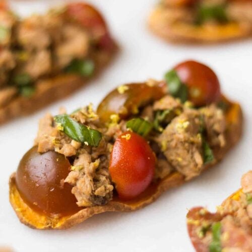 A paleo and Whole30 approved protein packed, this Tuna Bruschetta on Sweet Potato Toast makes easy, healthy, and crowd pleasing appetizer or snack! - Eat the Gains