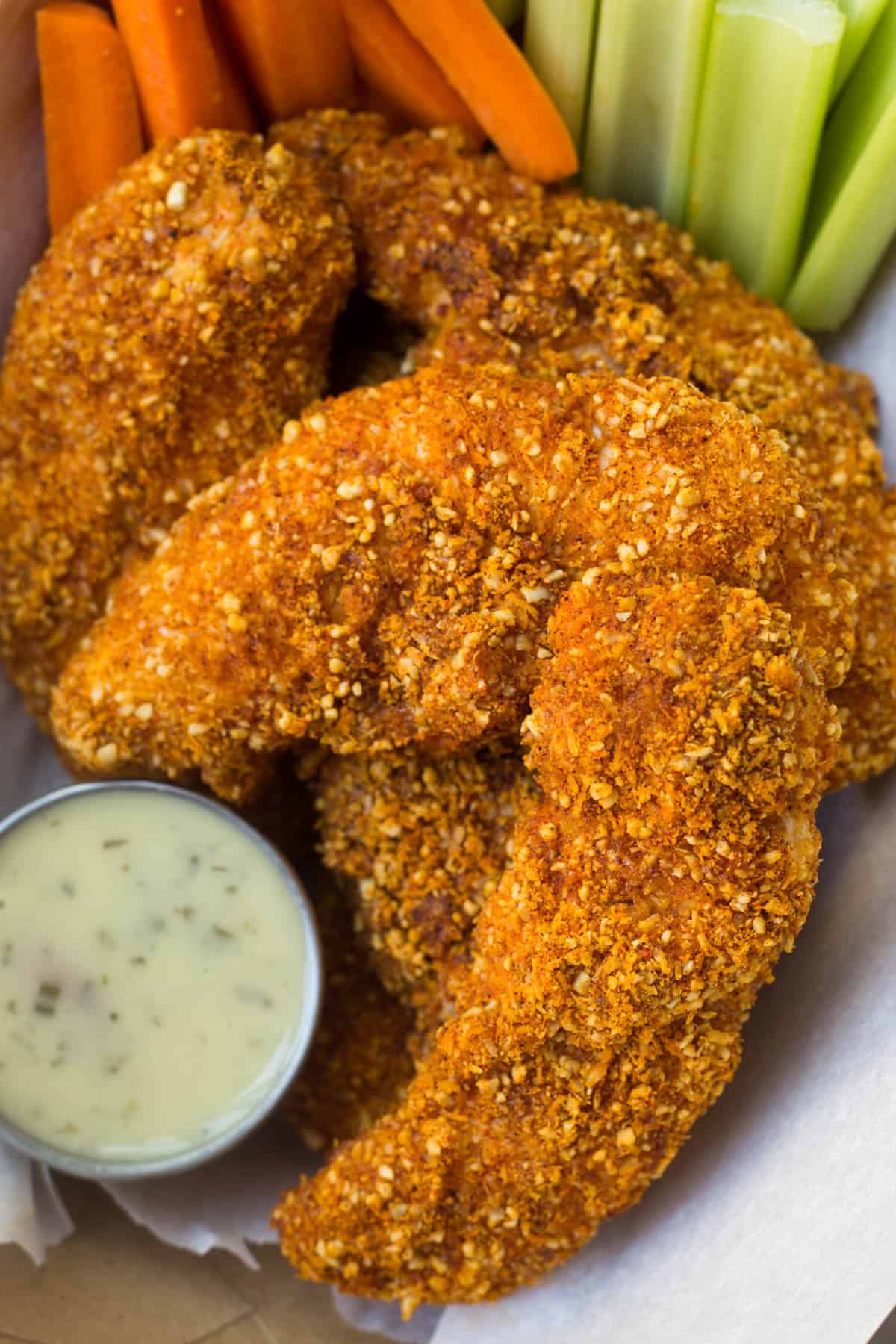 A healthy and gluten free spin on Buffalo Chicken Tenders! They take 30 minutes and are paleo & Whole30 approved - perfect for lunch, dinner, or tailgating! - Eat the Gains