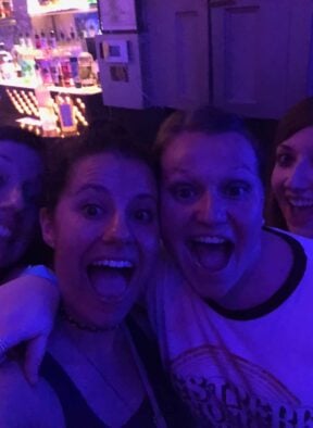 Two girls in a night club having fun