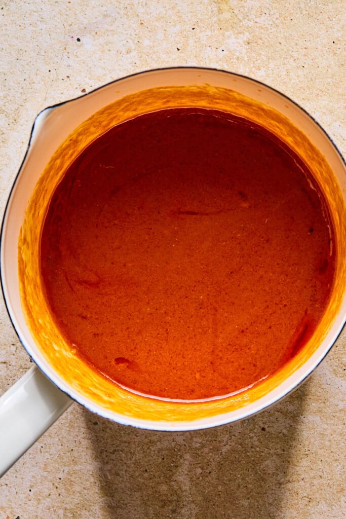 Boneless buffalo wings sauce in a small sauce pan.