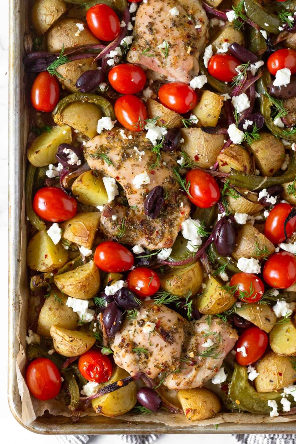 Greek Sheet Pan Chicken w/ Potatoes & Veggies - Eat the Gains