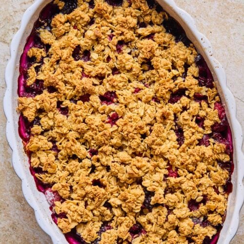 Overhead shot of oatmeal berry crisp in an oval casserole dish.